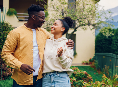 couple outside newly purchased home